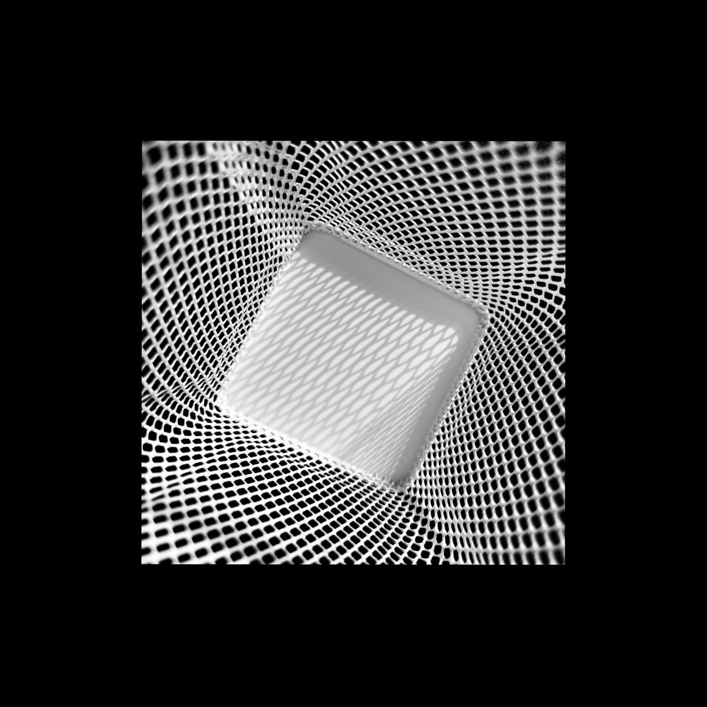 A bright square floating in a swirling moire mesh.